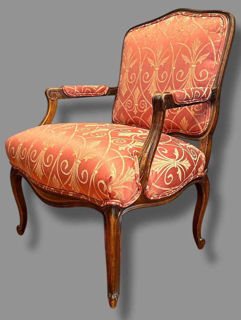 Louis XV Style Carved Bergere: Carved walnut frame with newly upholstered Fleur-de-lis pattern. 37" H to back x 19" H to seat x 26" W x 27" D