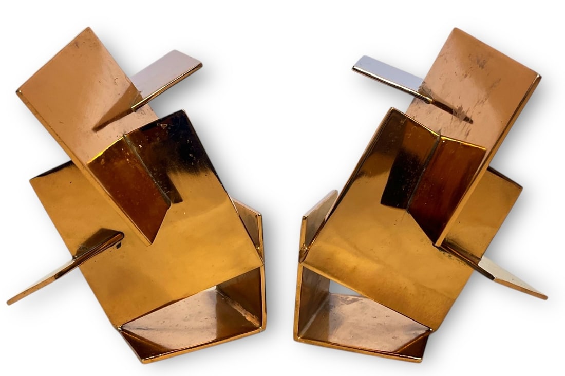 A Pair of Modern Cubist Copper Bookends: Both measure 5" H x 5" W x 6" D.