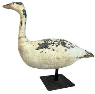 An Antique Folk Art Painted Swan Decoy on Stand: 23" H including stand x 9" W x 26' D. Likely a painted canvas material over a wire base.