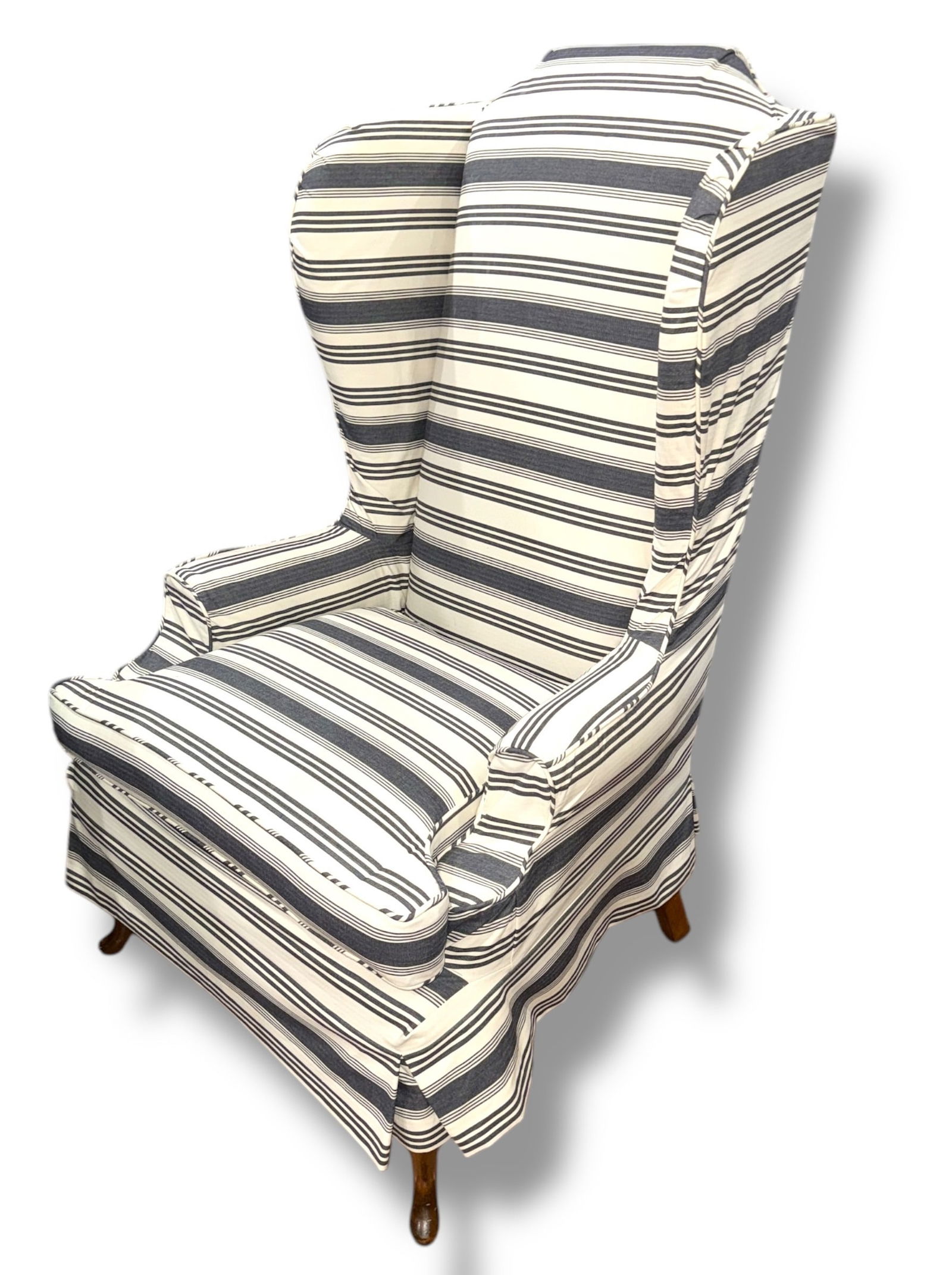 A Striped Queen Anne Style Wingback Chair: Measures 49.5" H to the back x 21" H to the seat x 31" W x 27" D. Chair has a red fabric but has a form fitting blue and white stripe slipcover.