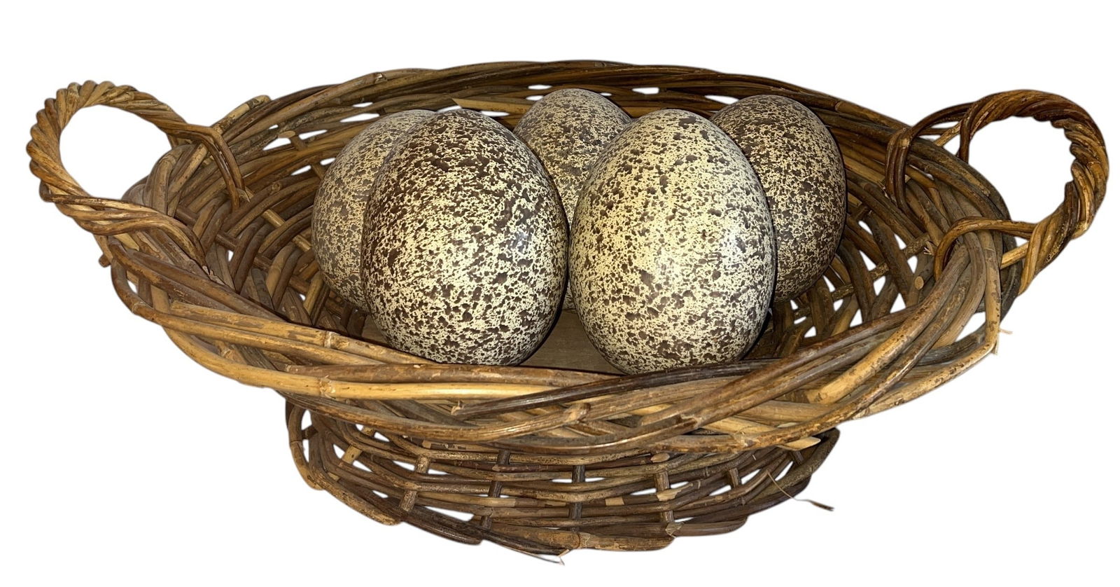 A Woven Wicker Basket with Faux Ostrich Eggs (1 of 3)