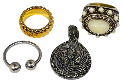 An Assortment of 14k Gold, Sterling Silver, & Marcasite Rings