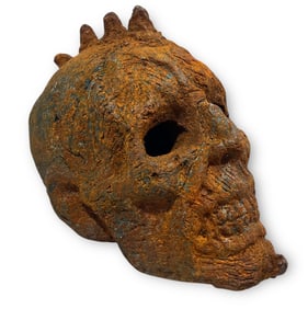 A Grotesque Forged Cast Iron Skull Sculpture