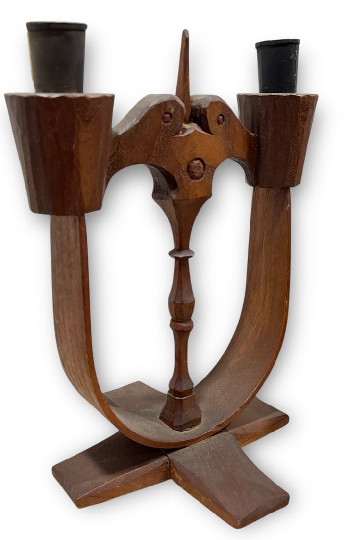A Late 19th C. Swedish Taserud Candle Holder: Carved wood and iron, marked on the base. Measures 10" H x 7.75" W x 7" D.