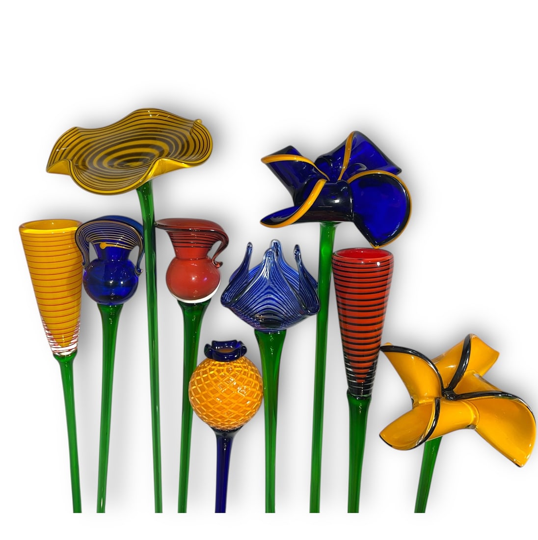 A Collection of Large MURANO Style Art Glass Flowers: All retain stickers from the Czech republic. The largest measures 30" long x 7" DIA, the smallest measures 28" long x 3" DIA.