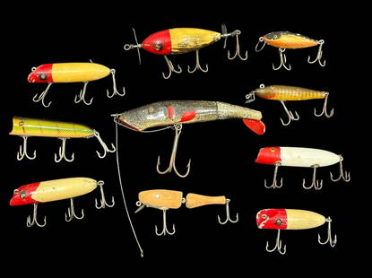Collection Vintage Wooden Fishing Lures, HEDDON, CREEK CHUB, PAW PAW: Includes various size lures, all wood. One unpainted Paw Paw. The Mudpuppy is the largest and measures 3.5" H x 7" W x 1" D.