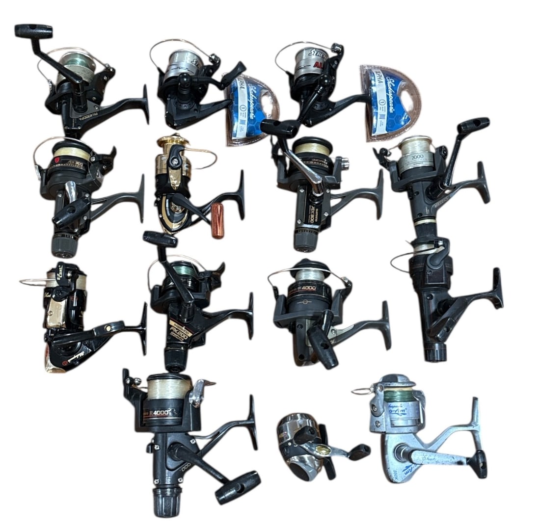 SHIMANO, SHAKESPEARE Fishing Reels 14 Pcs.: 13 Spinning, 1 Spincast. Various models and makes Some new never used. Largest measures 5.5" H x 6" W x 4" D.