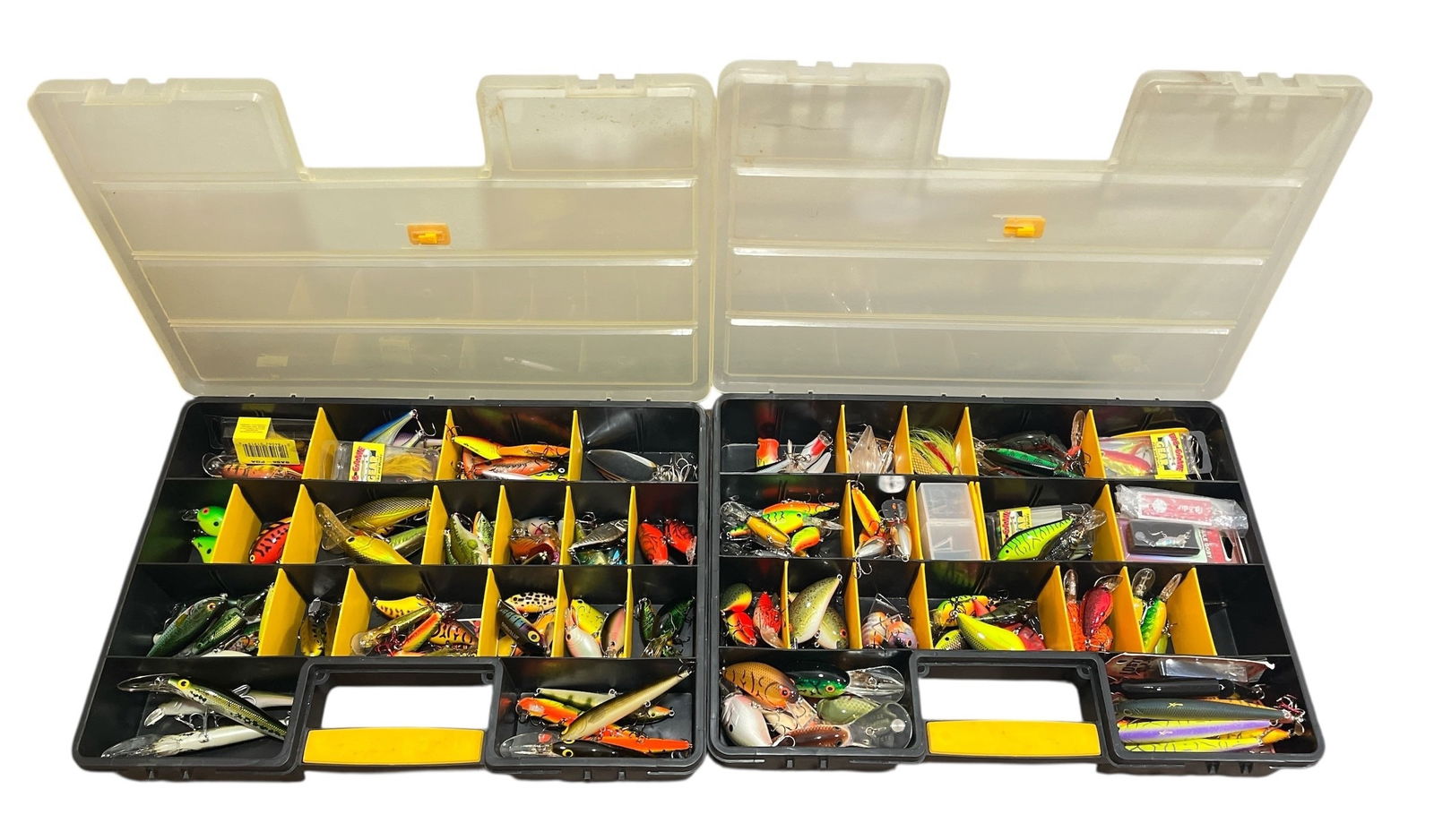 Two Large Tackle Boxes of Fishing Lures RAPALA, BAGLEYS, JITTERBUG: Includes Dardevle Fishing Spoons, Some NOS Pike, Musky, and Walleye Gear. Each tackle box measures 12.25" H x 18" W x 3.25" D.