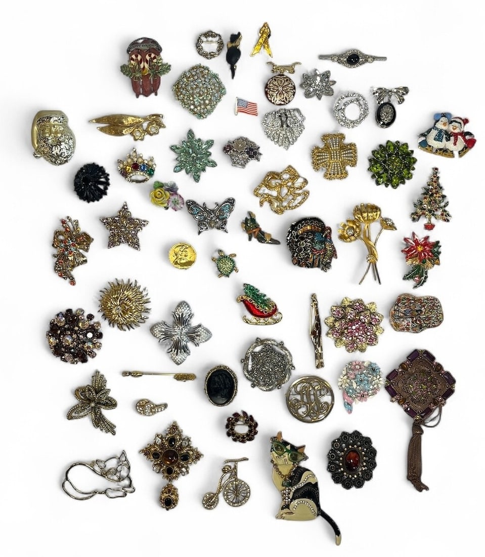 Collection of Vintage Costume Jewelry Brooches: Largest brooch measures 2.75" H x 2.75" W pendant section measures 3". Includes brands such as Capri, Florenza, Joan Rivers, Heidi Daus, Trifari, Kramer, Kenneth Jay Lane, and more. Lot also includes