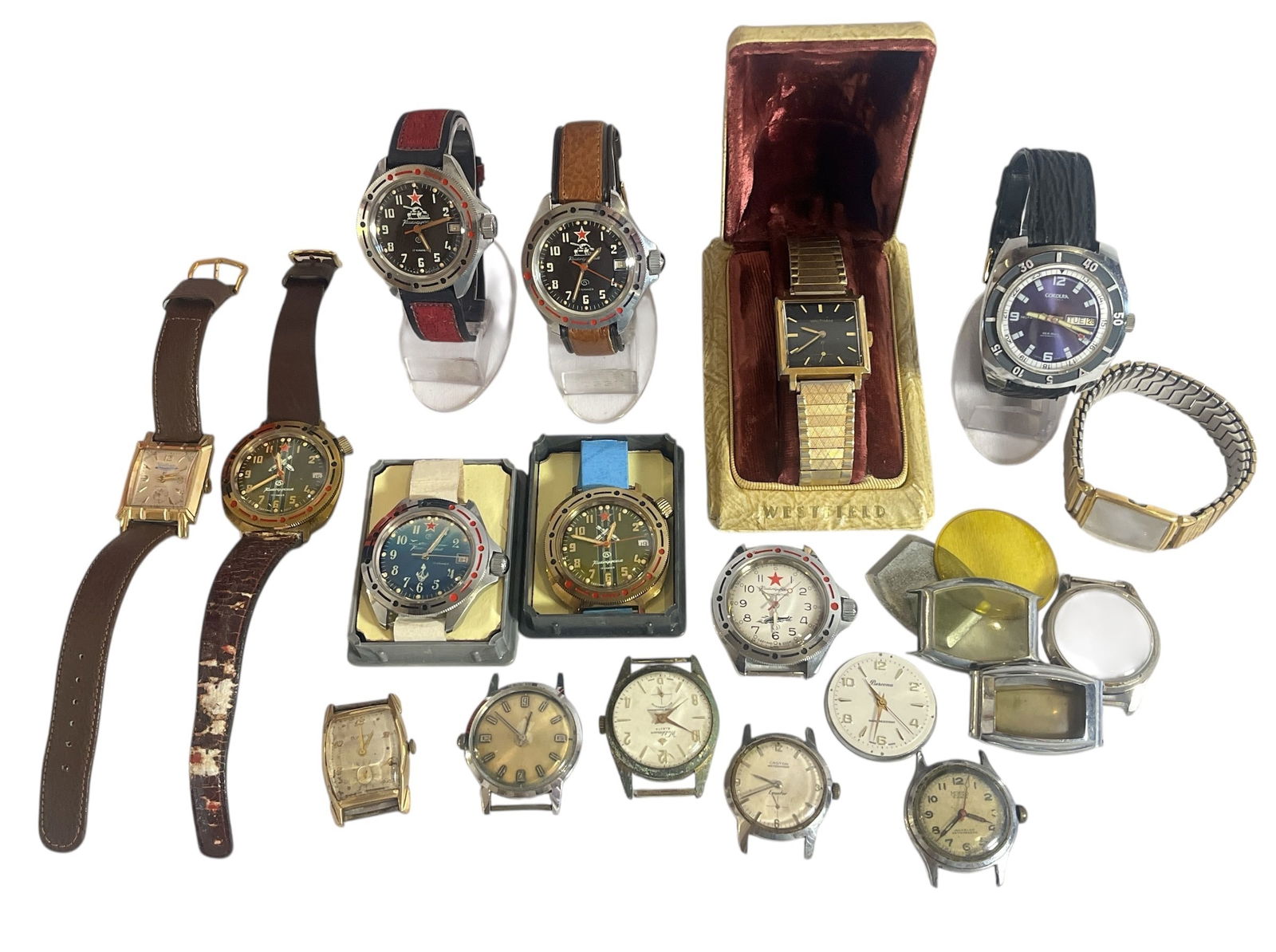 Collection Vintage Watches and Watch Parts: Includes Waltham, Cordura, Komandirskie, Bulova, Weldman, Croton and more. Lot includes watches with bands, watch faces, and watch parts. Longest band is approx. 9" L.