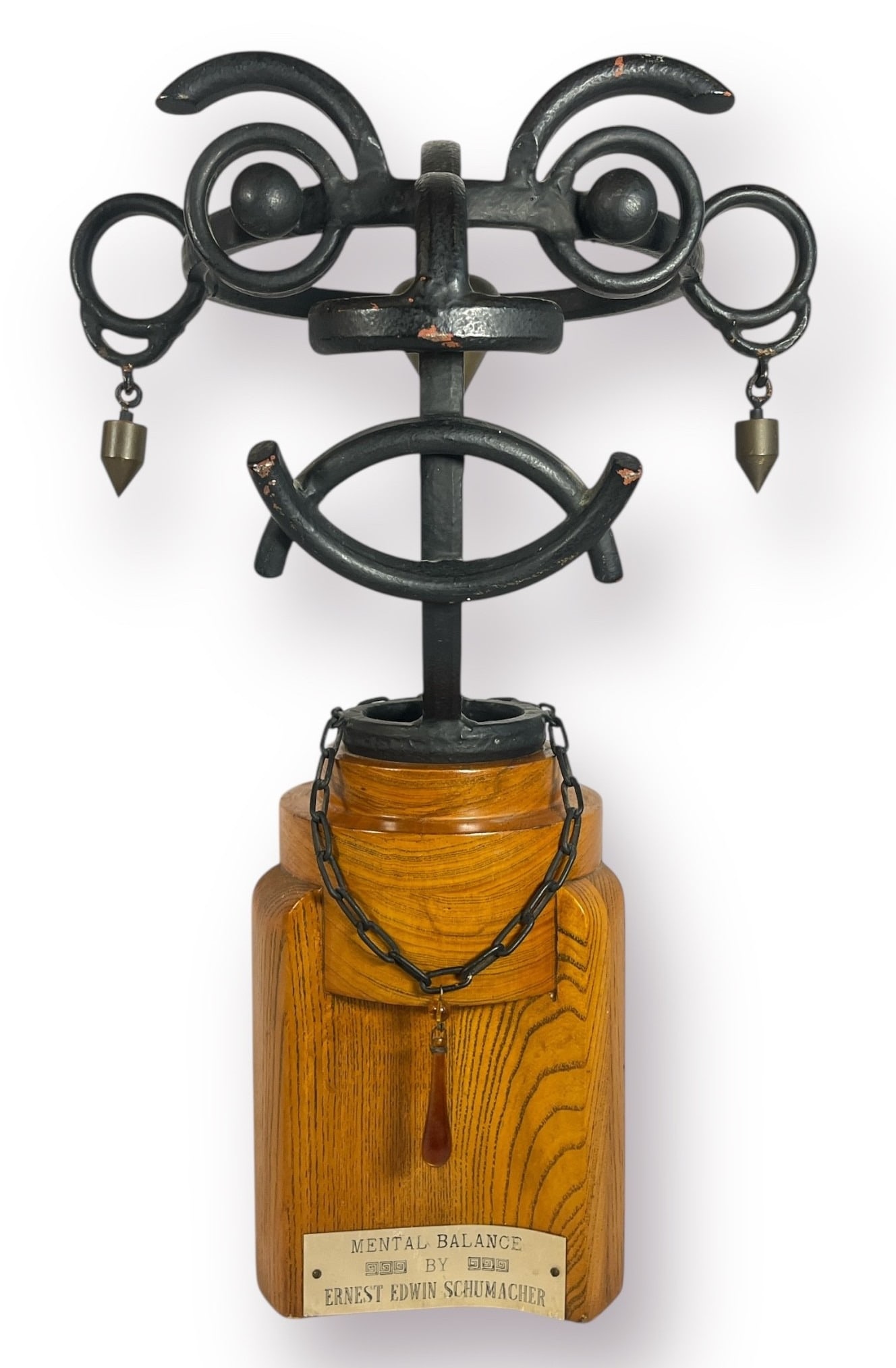 "Mental Balance" By ERNEST EDWARD SCHUMACHER: Measures 20" H x 12.5" W x 11" D. Folk art metalwork sculpture.