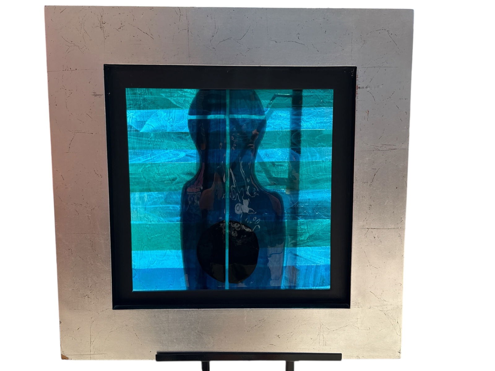 Signed DAUM Art Glass in Frame: The window itself measures 25.5" H x 25.5" W x 1.5" D, the window on the easel measures 59.25" H x 17.5" D. Signed in the lower right corner.