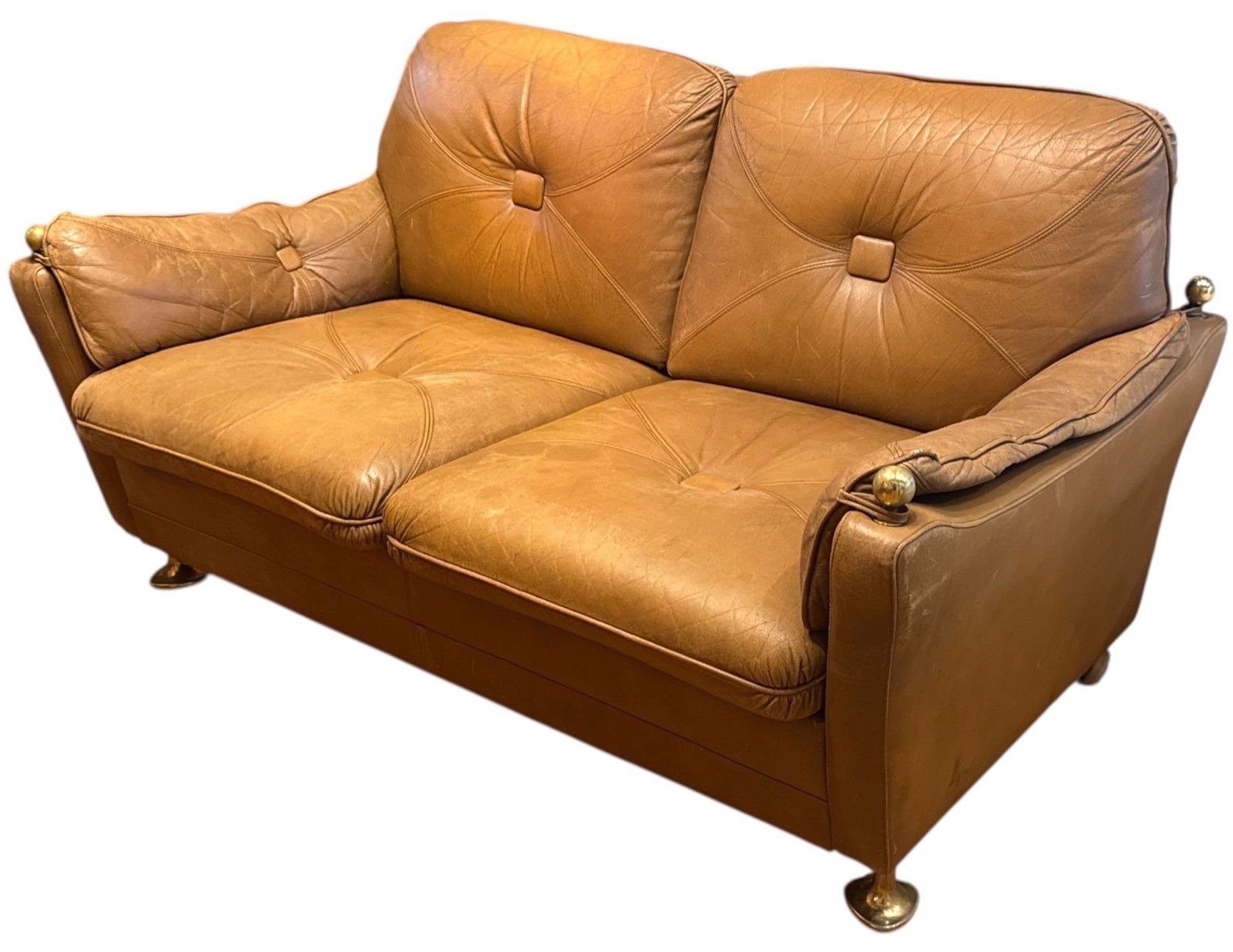 A Mid Century Italian Leather and Brass Sofa: 29" H to the back x 15.5" H to seat x 56" W x 36" D.