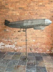 A Large Model Zeppelin Blimp Sculpture on Stand