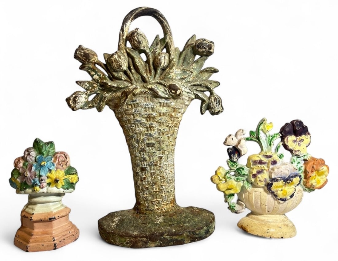 Three Cast Iron Figural Flower Bouquets Doorstops, HUBLEY Style: Includes a large flower bouquet in woven basket measures 13" H x 7.25" W x 2.25" D, second largest piece measures 6.75" H x 7" W x 1.5" D, the smallest piece measures 6" H x 3.5" W x 1.5" D.