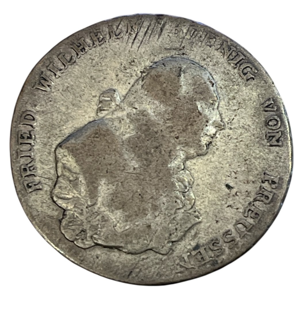 A Prussian King Friedrich Wilhelm Silver Thaler Coin: Date Unknown. As found condition. Ungraded. Please contact RA for more information.