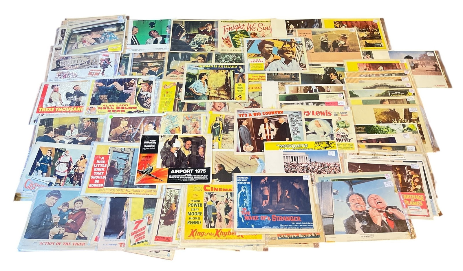 Large Collection of Movie Lobby Cards, WARNER BROS: Includes various lobby cards of 1950s-60s films, most are copyright Warner Bros and Paramount Pictures. Such as Walt Disney's almost angels, three stripes in the sun, Night Passage, The Adventures, Ai