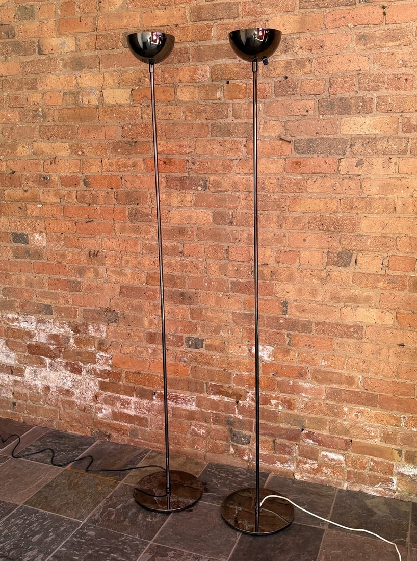 A Pair of ROBERT SONNEMAN Smoked Chrome "Torchiere" Floor Lamps: 73.5" H x 7" shade diameter x 12" base diameter.