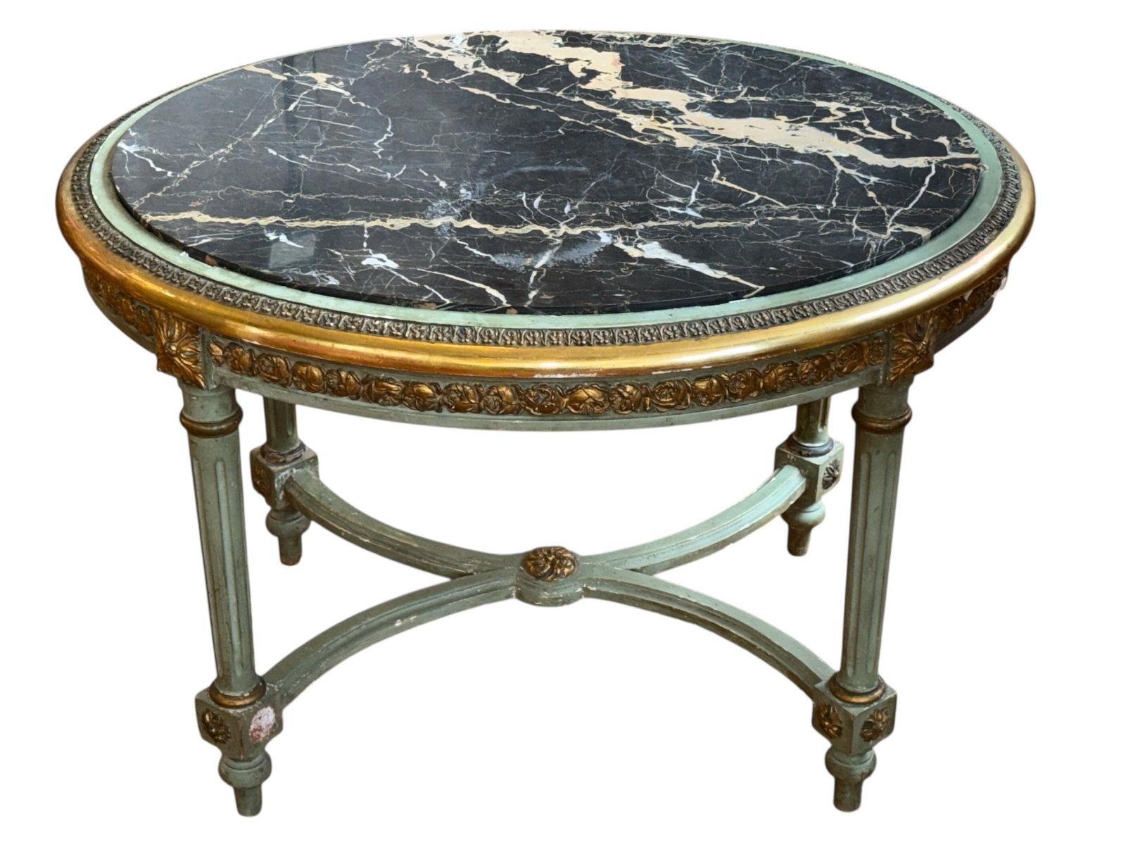 A Louis XV1 Revival Marble & Gilded Table: 20" H x 30" W x 22.5" D. Black marble This table is from the first half of the 20th C, likely 1920's.