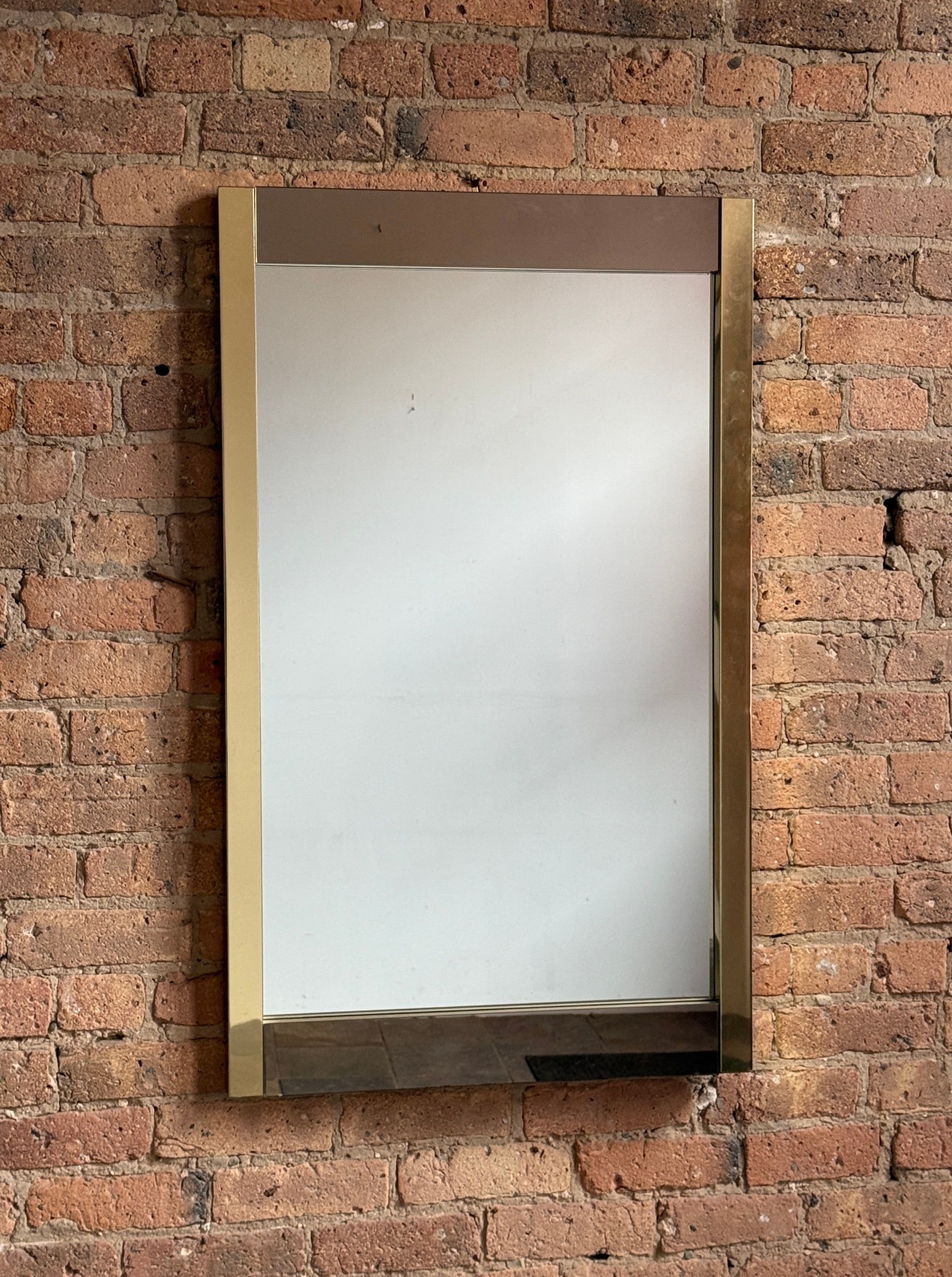 Mid Century Smoked Glass & Gold Accent Mirror: 40.25" H x 24.25" W x .75" D.