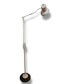 A Vintage Industrial Articulating Floor Lamp