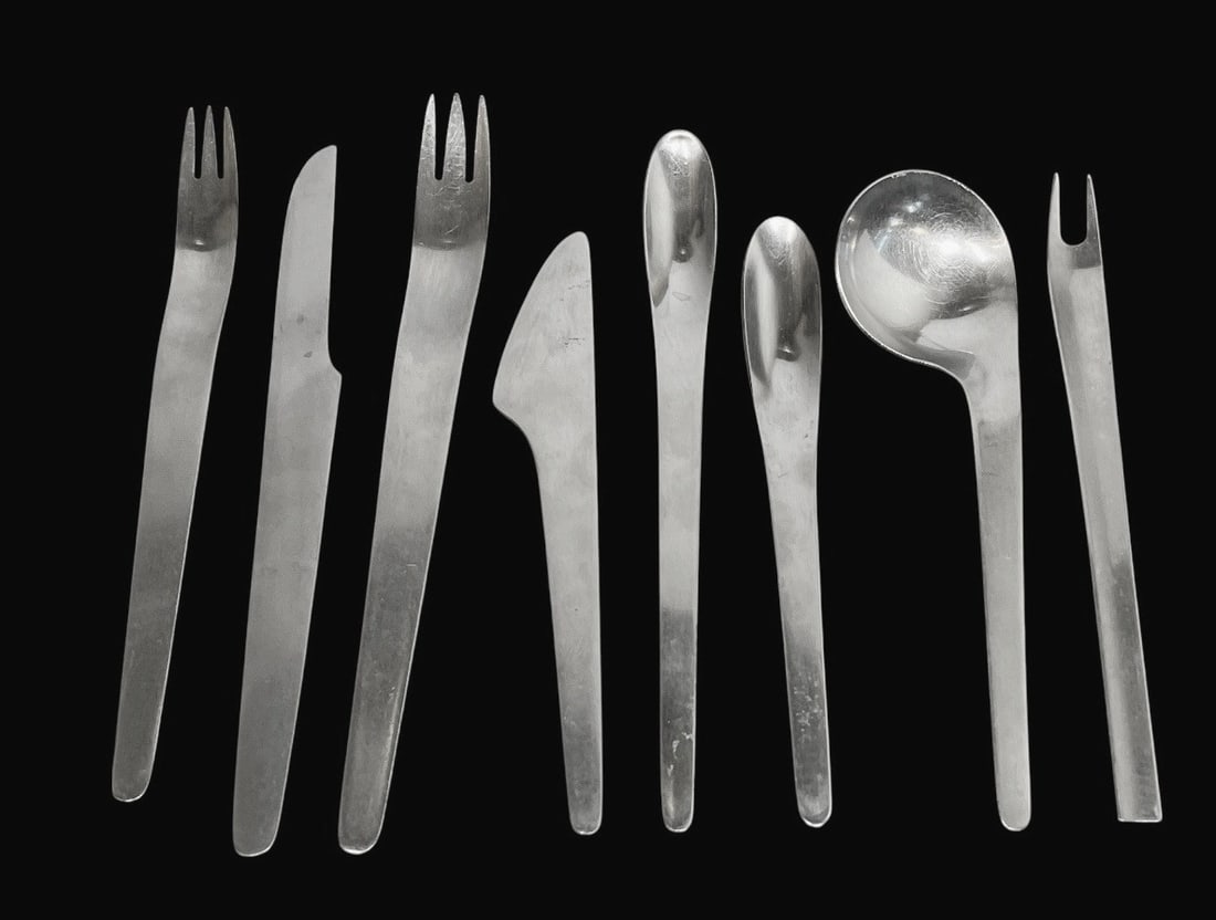 An Assortment of ARNE JACOBSEN, A. MICHELSEN Flatware: Includes Arne Jacobsen by A. Michelsen flatware in addition to Arne Jacobsen for George Jensen. Includes 35pcs by A. Michelsen and 23pcs for George Jensen. The Arne Jacobsen for Anton Michelsen flatwa