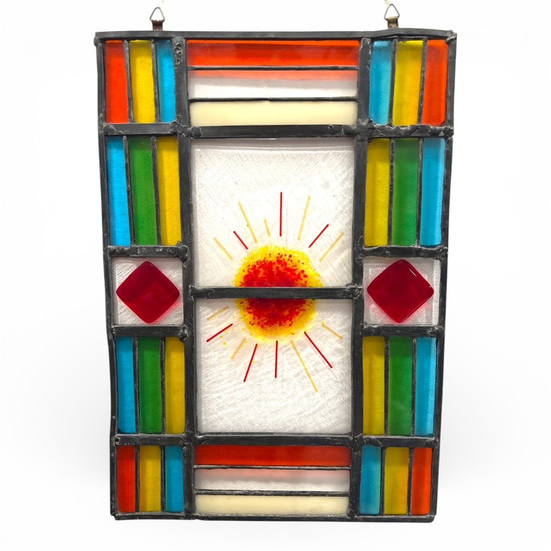 An Antique Stained Glass Window: Measures 17.5" H x 12" W.