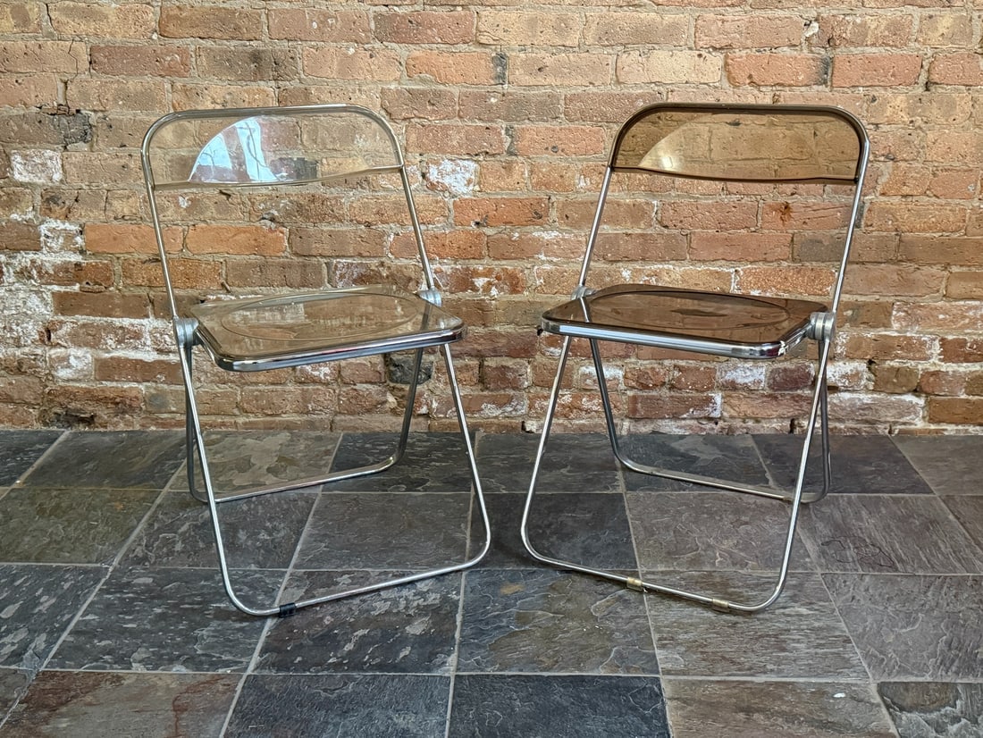 Two GIANCARLO PIRETTI "Plia" Folding Chairs: 29" H to back x 17" H to seat x 18" W x 18" D.