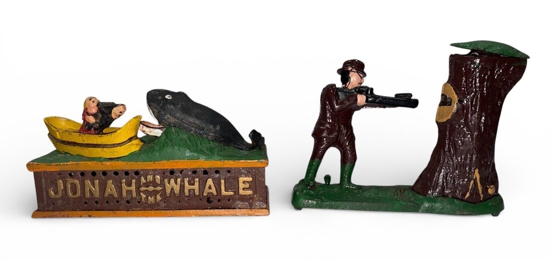 Two Vintage Cast Iron Mechanical Banks: Includes "Jonah and the Whale" mechanical bank that measures 5" H x 9.5" W x 3.5" D and "Teddy and the Bear "bank depicting Theodore Roosevelt that measures 7.5" H x 9" W x 3" D. Made in Taiwan.