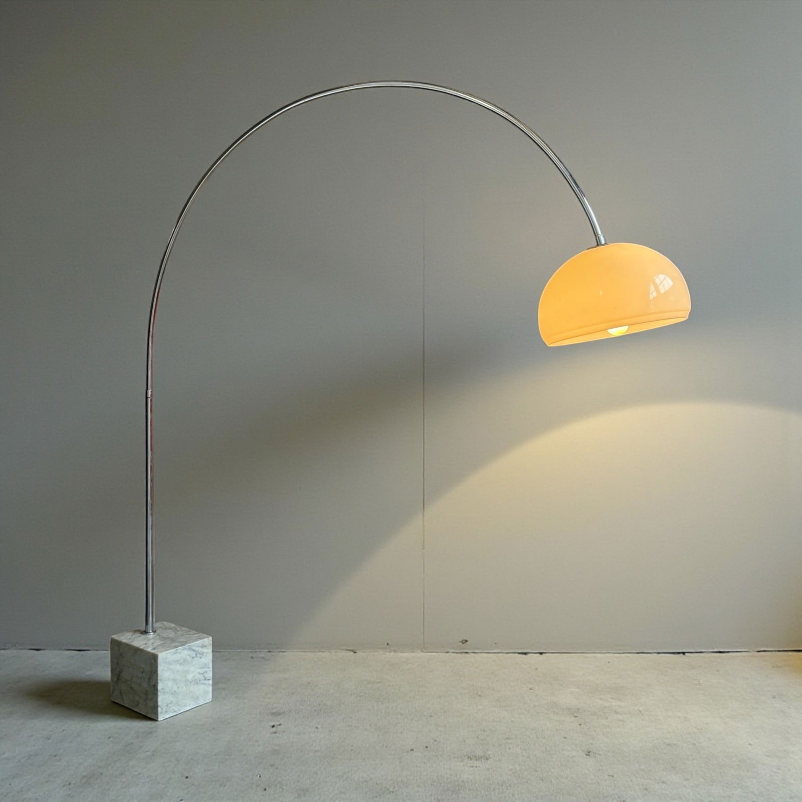 Italian Mid Century Chrome & Marble Arc Lamp: 80" H x 75" reach x 15" shade diameter. Marble base measures 9" W x 11" D. Has 2 different light settings. Unbranded, but has "made in Italy" at the bottom of the marble base.