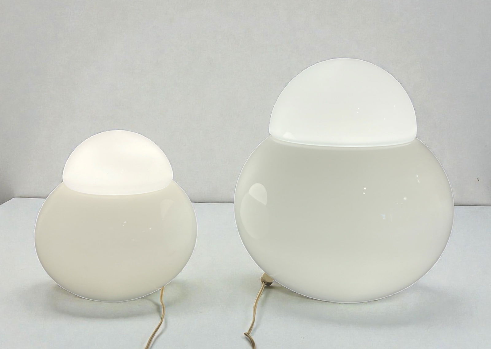 Two SERGIO ASTI "Daruma" Table Lamps, CANDLE: A large and small set of Daruma table lamps by Sergio Asti for Candle. The larger lamp measures approx. 17" H x 15" DIA, the smaller measures approx. 12" H x 10" DIA.