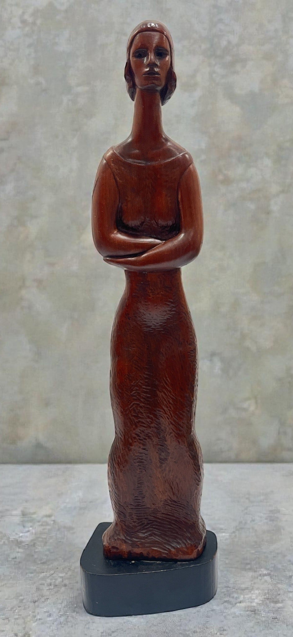 JUAN BLANCO LOPEZ (Cuban, 1929) Carved Sculpture of a Woman: Wood. Measures 22" H x 6" W x 4" D. Signed on base, inscribed JBL on side of sculpture.