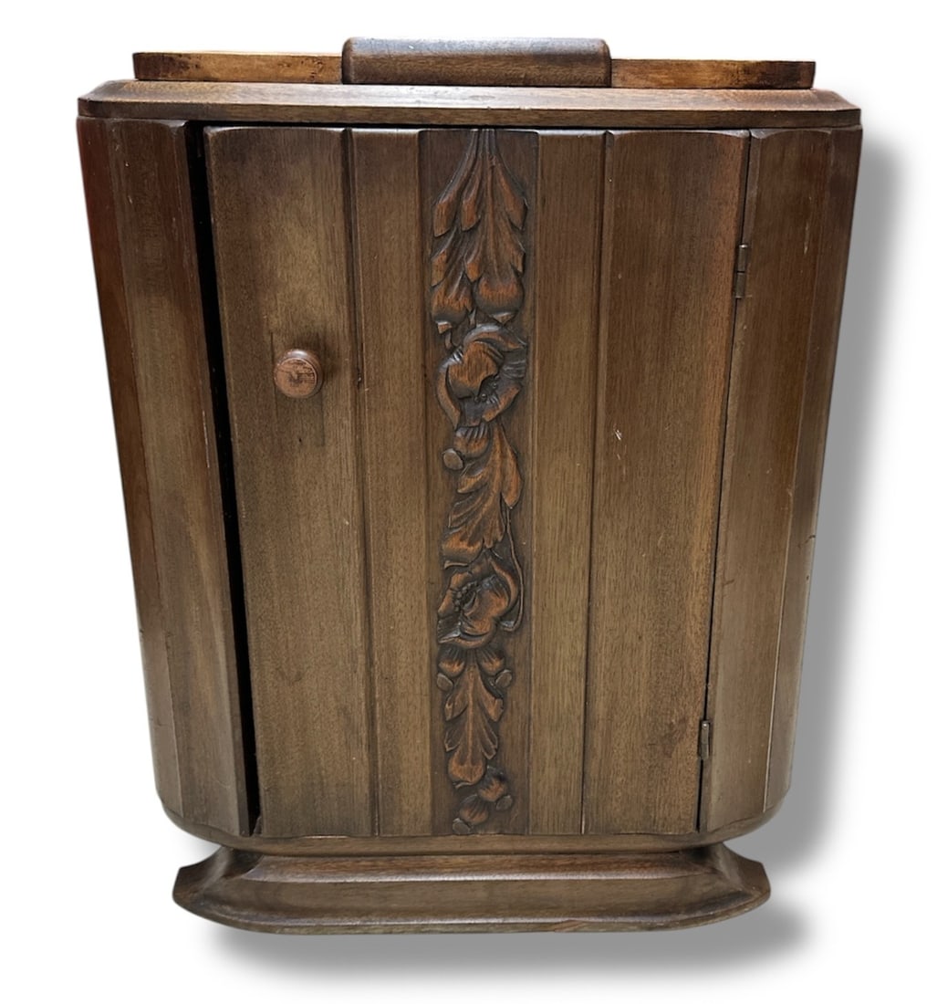 Art Deco Nightstand: 27.5" H x 21.5" W x 14.5" D Made of walnut with carved floral motif down the door which reveals a shelf and one drawer.