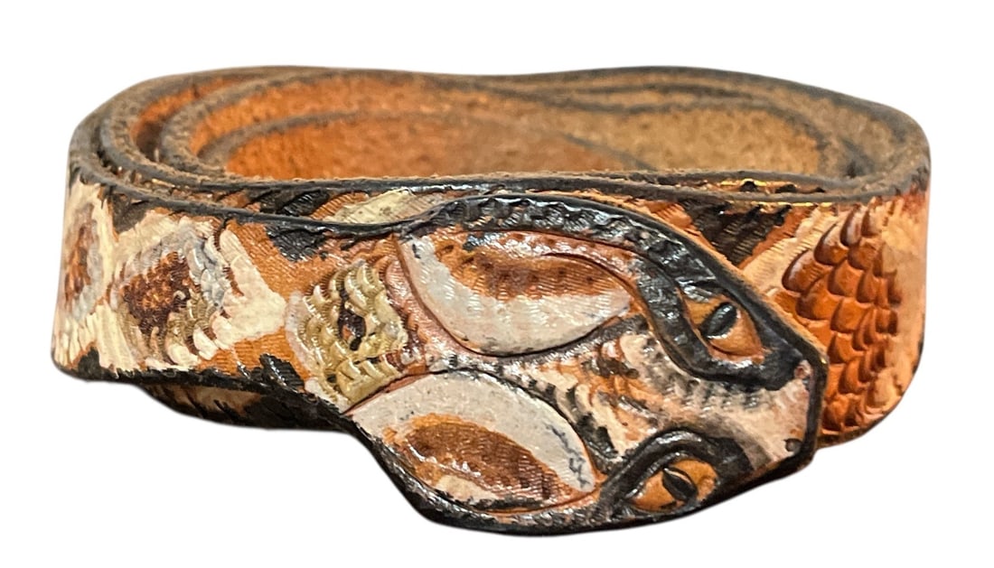 Vintage Rattlesnake Leather Belt: measures total length of approx. 50" x 1.25" W. Buckle measures approx. 2" x 1.5". Signed T. Sawyer and dated 1998 en verso of buckle.