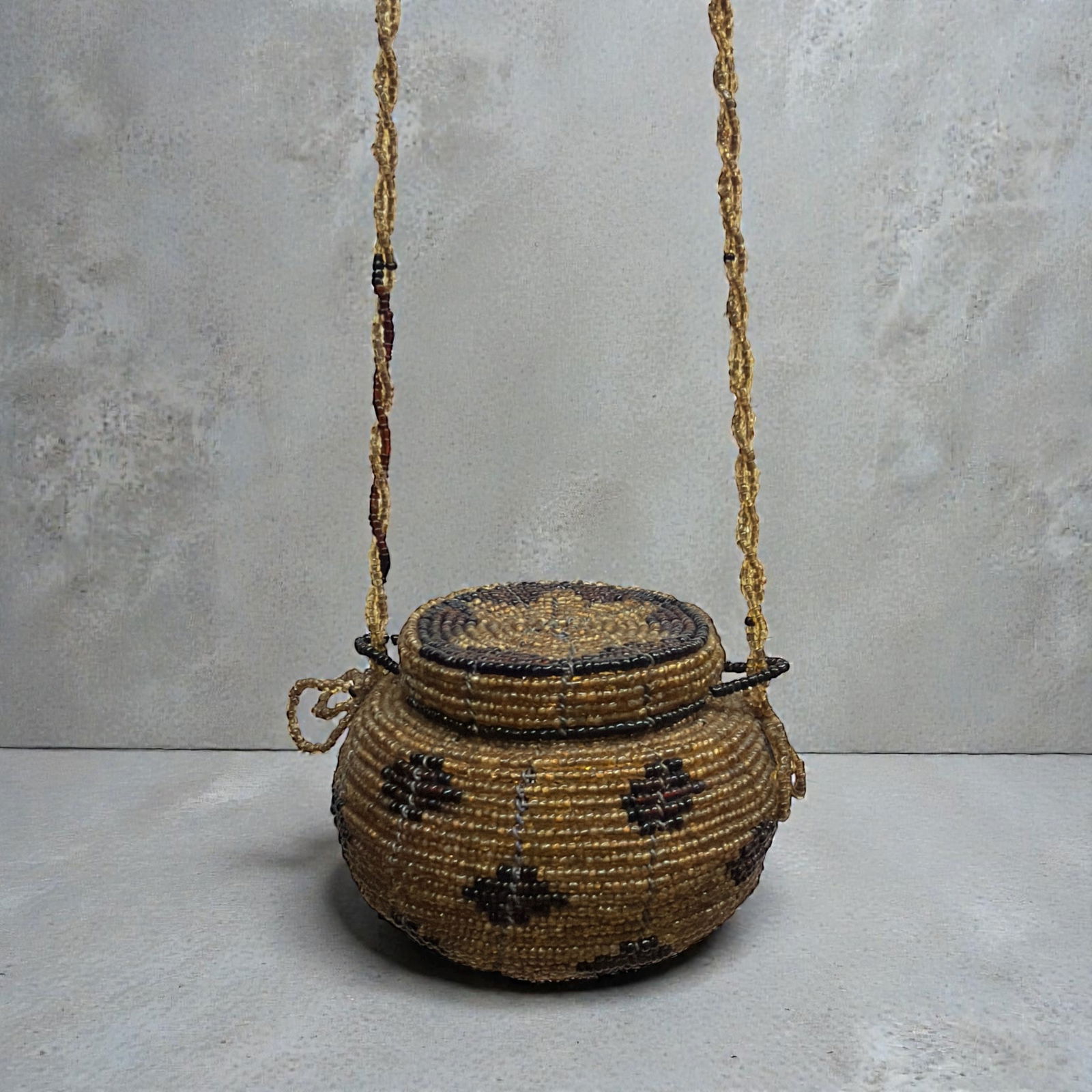 Native American Beaded Seed Basket: Baset itself measures 2.5" H x 3.5" DIA, strap measures 22" long.