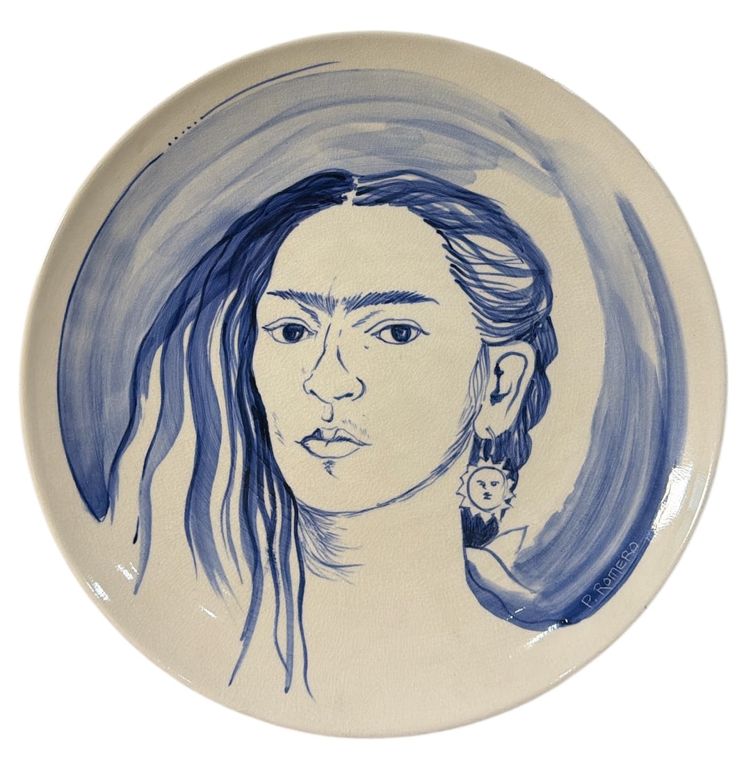 A FRIDA KAHLO Hand Painted Plate: Measures 1.5" H x 11.75" diameter. Signed P. Romero.