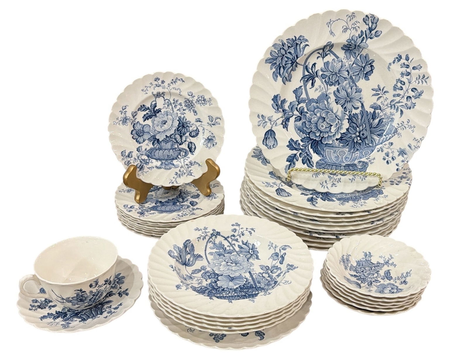 CLARICE CLIFF (English, 1899-1972) "Charlotte" Dinnerware for ROYAL STAFFORDSHIRE: Includes 34 pieces of blue transferware, 11 dinner plates measuring 10" diameter, 1 salad plate, 1 cup/saucer, 6 dessert bowls, 5 salad bowls measuring 8" diameter, and 8 dessert plates.