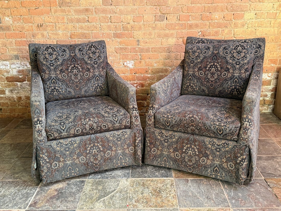 A Pair of BERNHARDT Paisley Swivel Club Chairs: 34" H to the back, 18" H to seat x 26" W x 36" D. Both chairs retain BERNHARDT Tags.