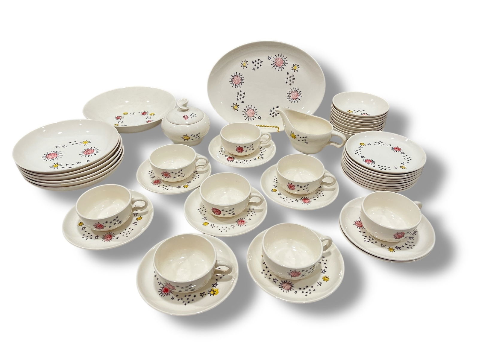 Collection of Mid Century Atomic Dinnerware, 40+ Pcs.: Made in USA atomic pattern dinnerware. Includes eight sets of coffee cups and saucers, nine dessert bowls, six salad bowls, one serving bowl, one serving platter, one extra saucer, nine dessert
