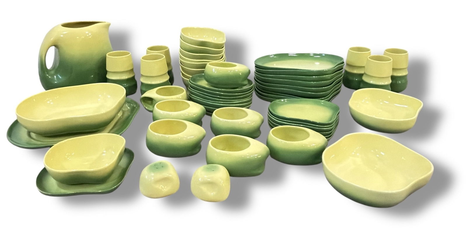 Large Collection of Mid Century TAMAC Dinnerware, 50+.: Includes an assortment of dinner plates measuring 10.5" x 10.5", a pitcher measuring 8.25" H x 6" W x 9" spout to handle, mugs, salt & pepper shakers, a serving tray, serving bowl, dessert bowls,