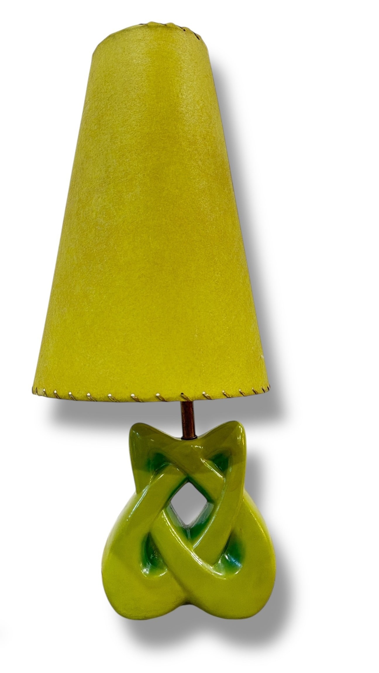 Mid Century Sculptural Base Table Lamp: Features a ceramic base with a fiberglass and leather shade. Measures 2" H to top of shade x 7.5" W x 3.25" D at the base.