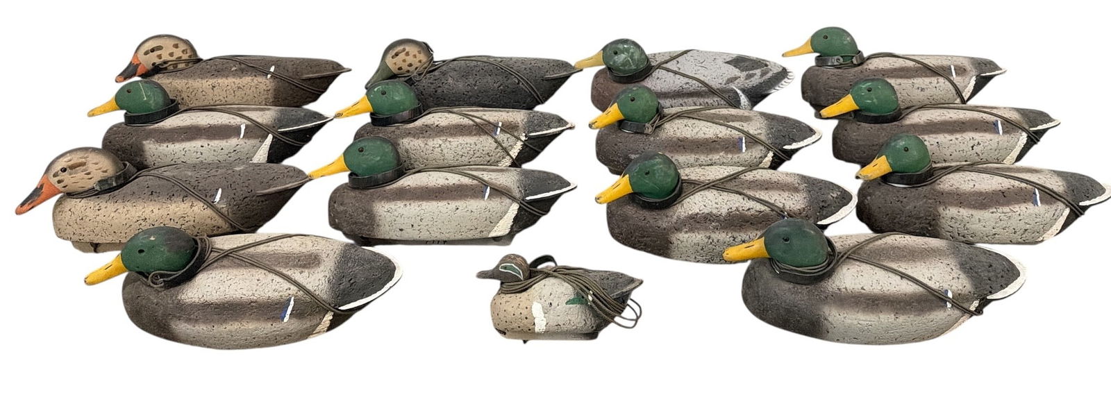Large Collection of Cork Hunting Duck Decoys: The smallest measures 6" H x 5" W x 10" D, all others are approx. 7.5" H x 7.5" W x 18" D. Includes 15 decoys.