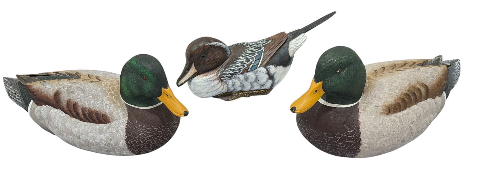 Three Vintage Duck Decoys, RANDY TULL, BEN HEINEMANN: Pintail duck decoy measures 4" H x 4" W x 12" D. Randy Tull Mallard duck decoy measures 5.25" H x 5" W x 11.75" D. Signed Ben Heinemann duck measures 6" H x 5.5" W x 12.5" D.