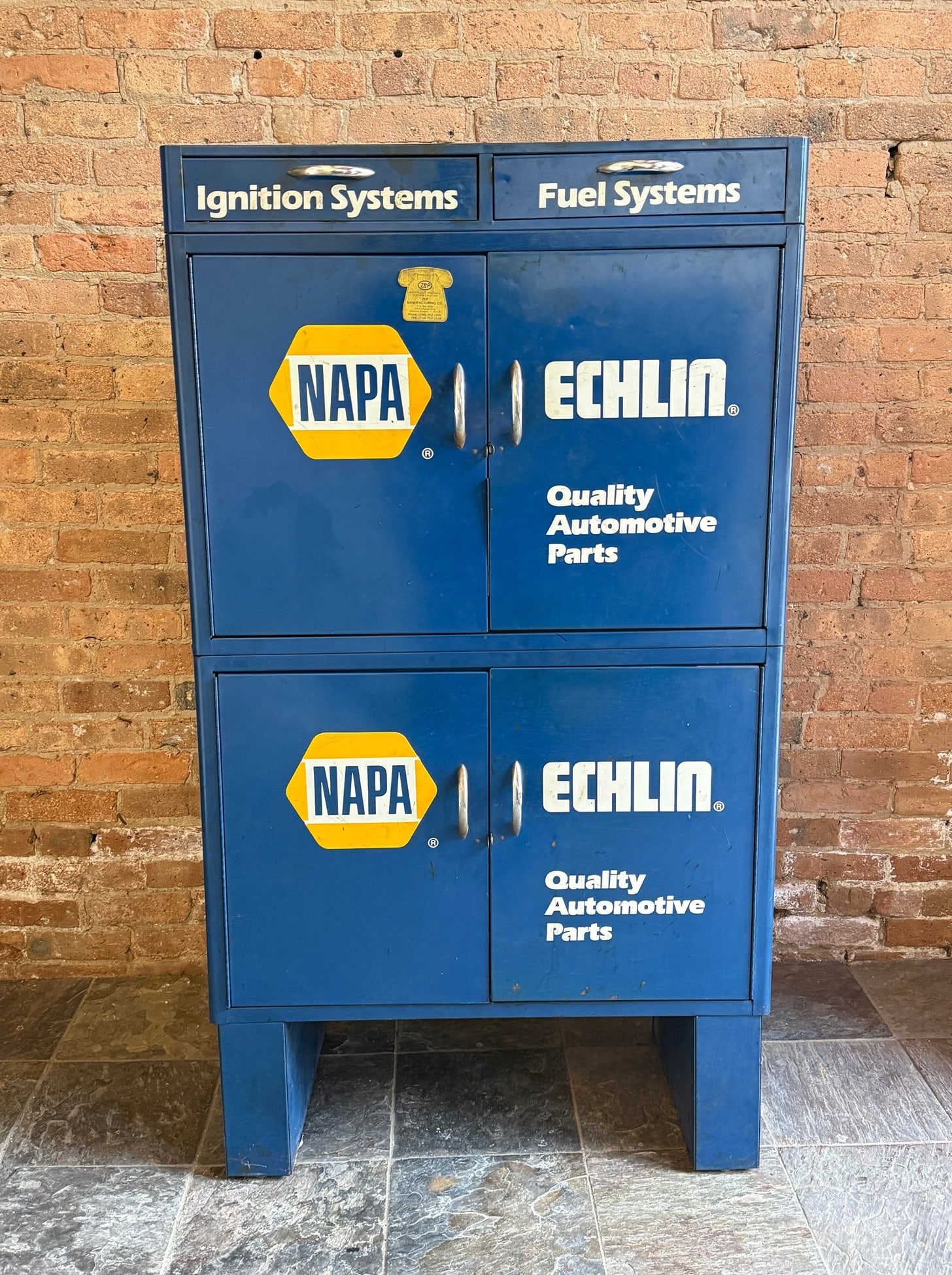 Vintage NAPA Echlin Automotive Parts Storage Cabinet: Metal. 58.5" H x 33" W x 17" D. From a multi-generational, family-owned service station in Chicago.