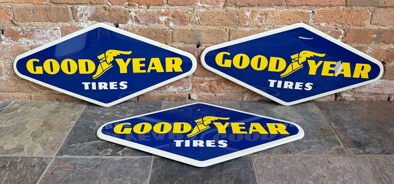 Three GOODYEAR Tires Advertising Signs: All measure 13.5" H x 28.5" W. From a multi-generational, family-owned service station in Chicago.