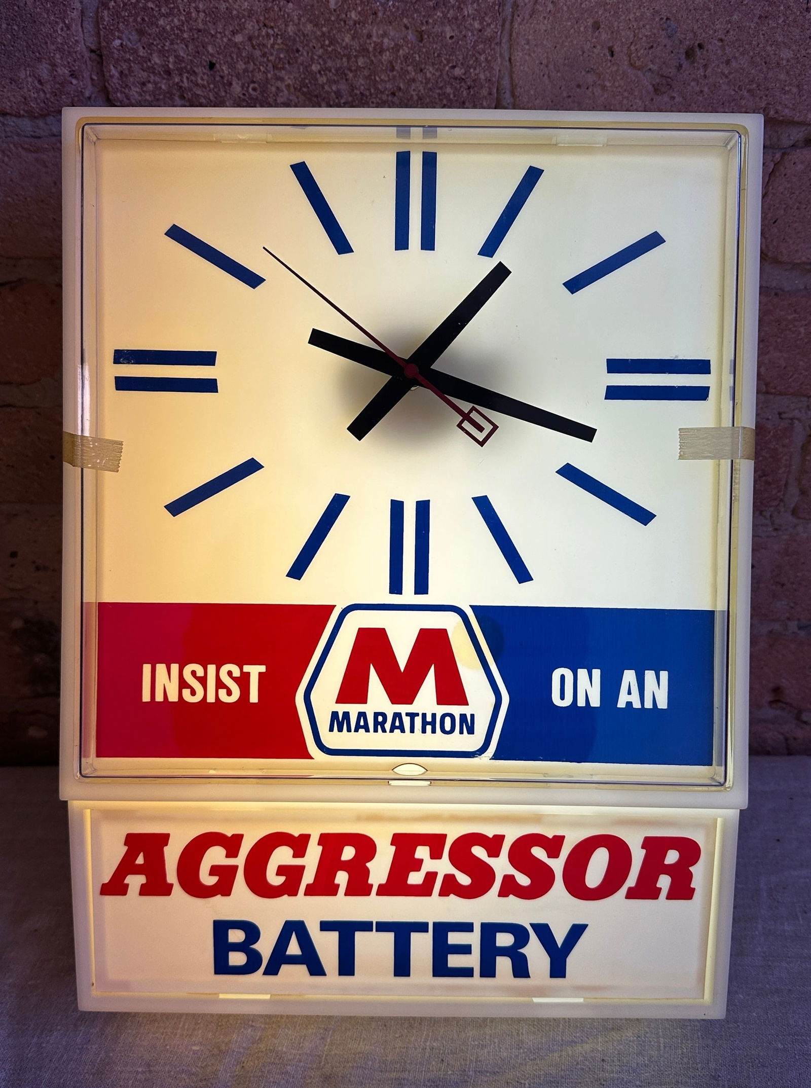 Vintage MARATHON OIL Aggressor Battery Advertising Clock: Running and working, New Old Stock never used. Will ship with original packaging. Clock runs and lights up. 16.75" H x 11.75" W x 6" D. From a multi-generational, family-owned service station in