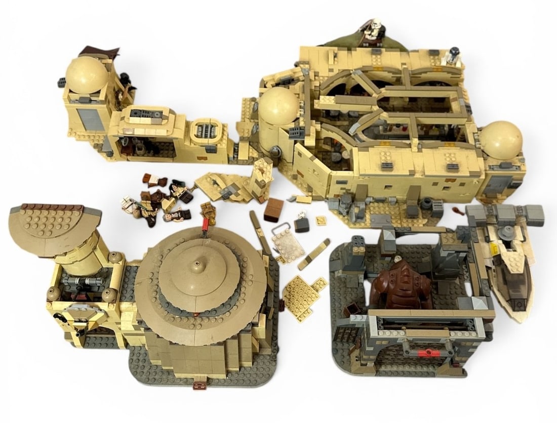 Two LEGO STAR WARS Sets, Mos Cantina & Jabba's Palace: LEGO sets include Mos Eisley Cantina set and Jabba's Palace set. Jabba's Palace measures 9.5" H x 11" W x 11.5" D.