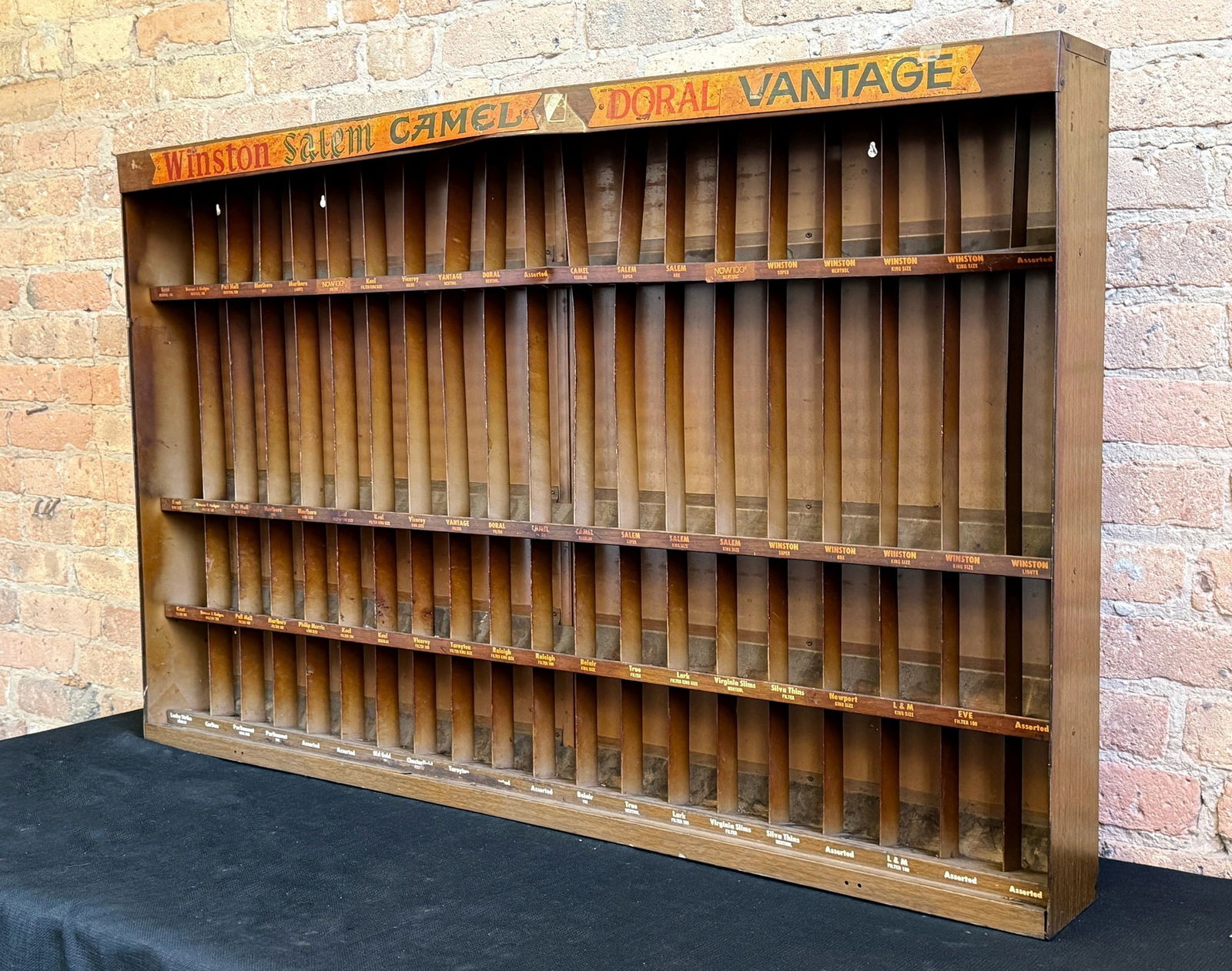 Vintage Cigarette WINSTON, SALEM, CAMEL, DORAL, VANTAGE Advertising Display Cabinet: Display also features MARLBORO, Pall MALL, VIRGINIA SLIMS, NEWPORT & more. Measures 30" H x 46.5" W x 5" D. Was used in a Chicago bar for over 40 years.