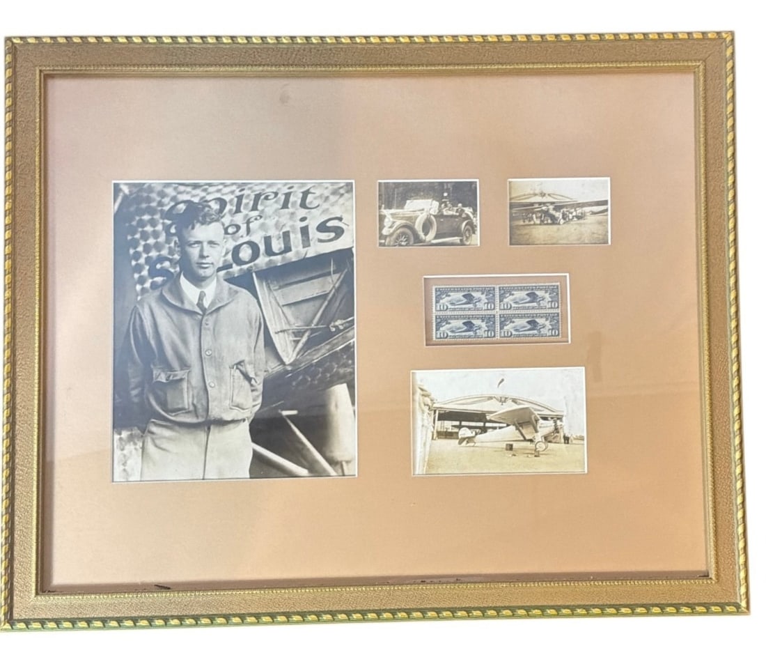 A CHARLES LINDBERGH "Spirit of Saint Louis" Collection: 18" H x 22" W x 1"D includes photos and stamps in a professional frame.