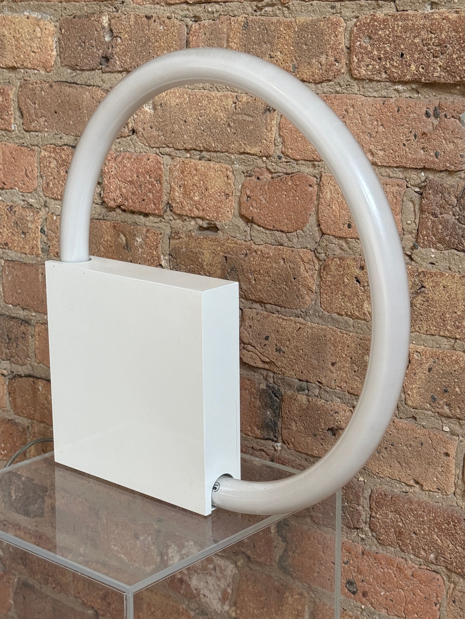 ALDO VAN DEN NIEUWELAAR (Dutch, 1944-2010) "Aldo TC6" Lamp, Netherlands 1972: Measures 16" diameter x 2" D. Retains original manufacturer's sticker on the bottom. This lamp can be used as either a table or wall lamp, thanks to an interlocking hole at the bottom of the block.